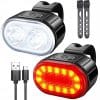 Črni kolesarski LED svetilki s polnilnim kablom USB na beli podlagi