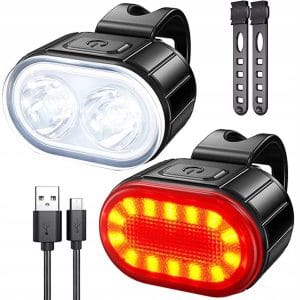 Črni kolesarski LED svetilki s polnilnim kablom USB na beli podlagi